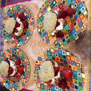 A colorful mosaic tile pattern with four plates and bowls.