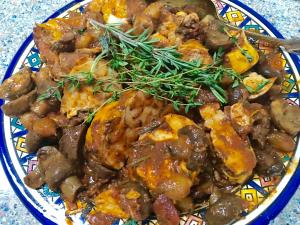 Braised chicken livers garnished with rosemary