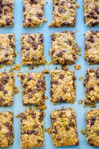 Homemade chocolate chip granola bars on blue