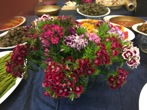 A table with many different flowers on it