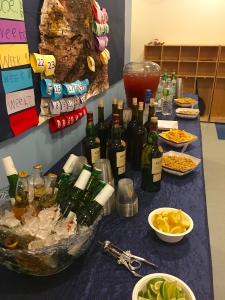 A table with many different types of food and drinks.