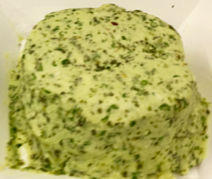 A close up of some food on top of a paper plate