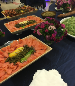 A table with many different types of food on it.