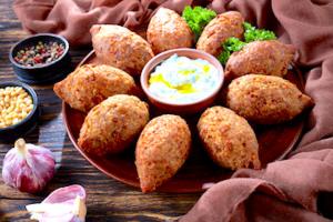 A plate of food with some bread and dip.