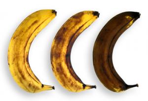 Three bananas are lined up in a row.