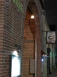 A brick building with a street light on the side of it.