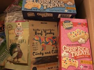 A variety of books and games are on the table.