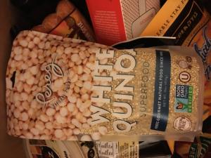 A bag of white quinoa sitting on top of a counter.