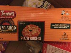 A box of pizza bagels sitting on top of a table.