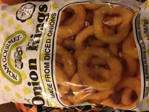 A bag of onion rings sitting on top of a table.