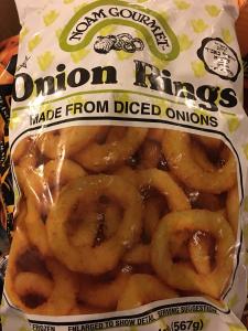 A bag of onion rings sitting on top of a table.