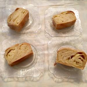 Four pieces of bread sitting on top of a table.