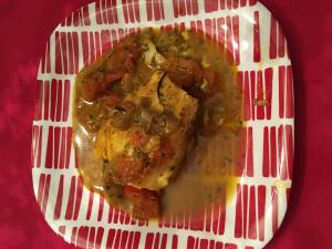 A plate of food on top of a red and white table.