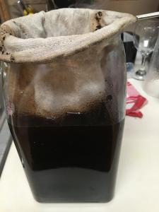 A brown glass container sitting on top of a table.