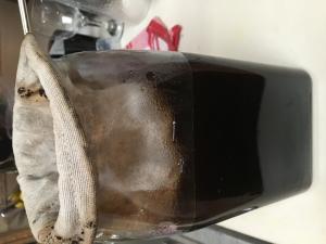 A brown bag sitting on top of the floor.