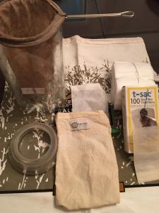 A table with some bags and cups on it