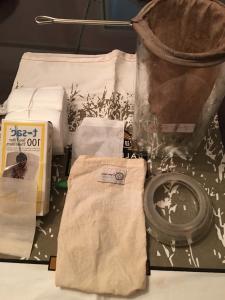 A table with some bags and papers on it