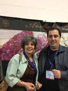 Two smiling attendees at deli trade booth