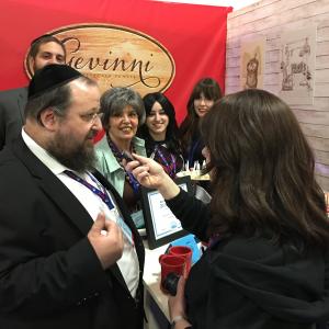 Person being interviewed at trade show booth