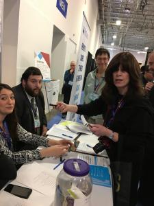 Attendees at conference registration table