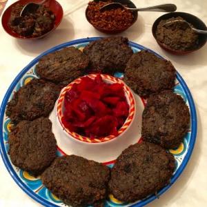 Dark savory patties surrounding pickled beets