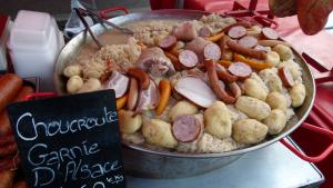 A pan of food with potatoes and sausage.
