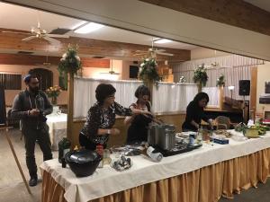 Community cooking demonstration in decorated hall
