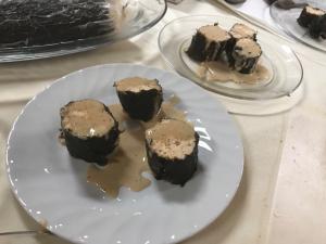 A plate with some chocolate cakes on it