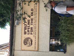 A sign on the side of a building that says " duluth lifeline for the old people."