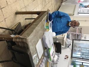 A man standing in front of a counter.
