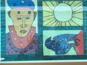 A close up of a painting with the sun and a man