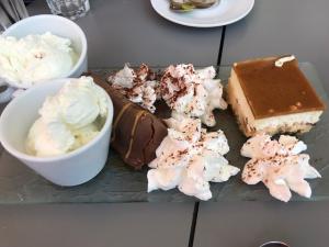 Assorted dessert platter: ice cream, cake, whipped cream