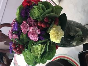 A bouquet of flowers sitting on top of a table.