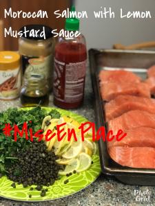 A table with food and sauces on it.