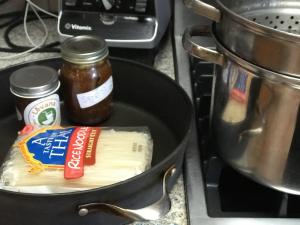 A pan with food on top of it next to an oven.