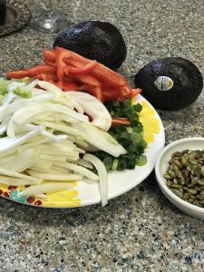 A plate of food on the table with other items.