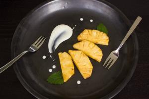 A black plate with some food on it