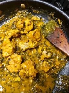 A pan of food with some type of meat and vegetables.