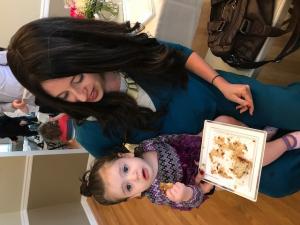 A woman and child sitting at a table.