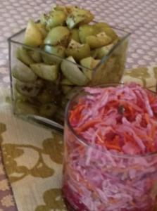 A bowl of fruit and a glass container with food.