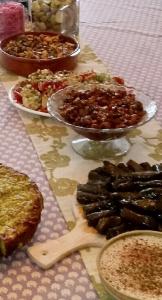 A table with food on it and plates of food