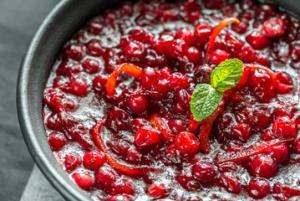 A bowl of cranberry sauce with red pepper.