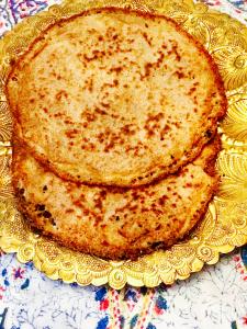 A close up of two pancakes on a plate