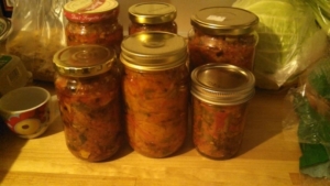 A group of jars filled with food on top of a table.