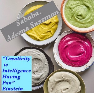 A group of bowls filled with different colored food.