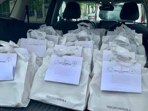 A car filled with bags of food and paper.