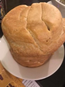 A loaf of bread sitting on top of a white plate.