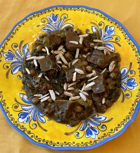 Hearty stew with greens and almond slivers