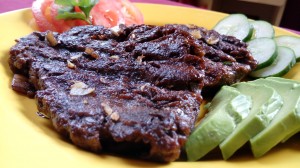 Glazed beef slices with avocado and cucumber