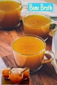 Two cups of tea on a wooden table.